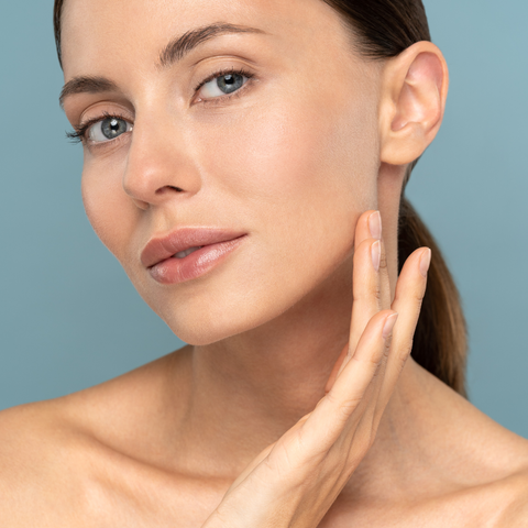 Woman touching face, skincare