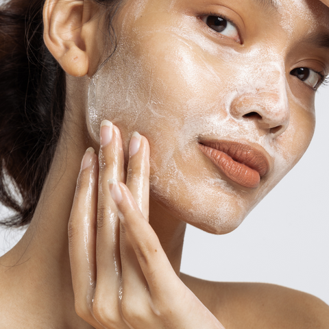 Women using foamy cleansing gel