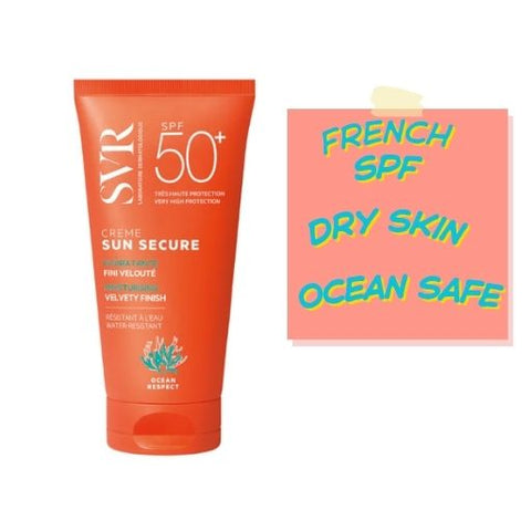 An orange tube of SVR Creme Sun Secure SPF 50+ sunscreen stands next to a pink sticky note with the text 'FRENCH SPF DRY SKIN OCEAN SAFE' in blue and yellow lettering, set against a plain white background.