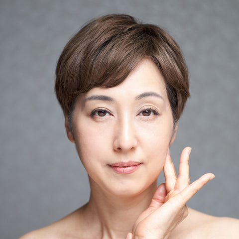 Woman with short brown hair representing aging in your 40s collection