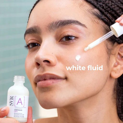 A close-up of a woman applying a white serum dropper to her cheek, with a bottle of SYR [A] Ampoule Gel in one hand and the text 'white fluid' overlaid on the image.